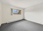 Thumbnail 16 of 29 - A photo of a Liberty Plaza Townhome Bedroom with  window.