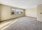 Thumbnail 4 of 12 - A room with a grey carpet and a window.