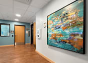 Thumbnail 25 of 35 - A lobby with an art print on the wall