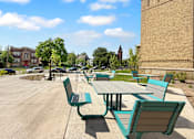 Thumbnail 14 of 35 - A large patio with a table and benches