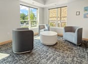 Thumbnail 32 of 35 - Community Room chairs surround round coffee table