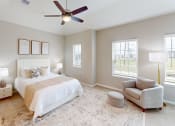 Thumbnail 5 of 40 - a bedroom with a bed and a ceiling fan