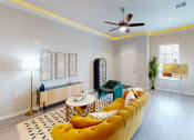 Thumbnail 1 of 40 - a living room with a yellow couch and a ceiling fan