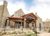 Thumbnail 11 of 40 - a view of the front of the building with a fence in front of it