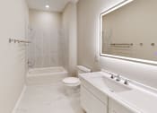 Thumbnail 17 of 17 - a white bathroom with a sink toilet and shower