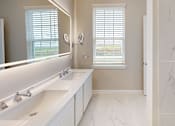 Thumbnail 14 of 17 - a bathroom with two sinks and a large mirror