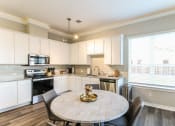 Thumbnail 7 of 22 - Open floor plan style kitchen with stainless steel appliances