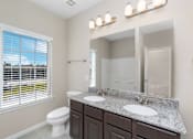 Thumbnail 7 of 15 - Bathroom With Vanity Lights at Mirror Lake Pearland, Pearland, 77584