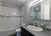 Thumbnail 14 of 20 - a bathroom with a sink toilet and bathtub