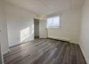 Thumbnail 4 of 12 - A room with a grey floor and a white ceiling.