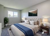 Thumbnail 13 of 16 - a bedroom with a large bed and a window