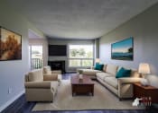 Thumbnail 14 of 16 - a living room with couches and a coffee table