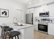 Thumbnail 8 of 16 - Taylor Saskatoon Rental apartment open kitchen