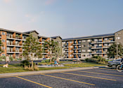 Thumbnail 16 of 16 - A modern apartment complex with a parking lot in front.