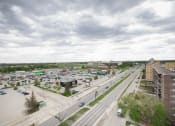 Thumbnail 12 of 21 - an aerial view of a city with traffic and buildings