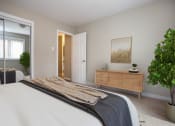 Thumbnail 9 of 15 - a bedroom with a bed and a closet