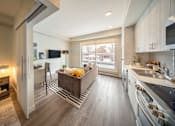 Thumbnail 3 of 30 - A modern kitchen with a view of the backyard.