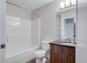Thumbnail 12 of 31 - a bathroom with a toilet sink and a shower
