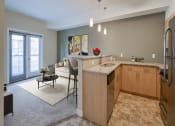 Thumbnail 8 of 31 - a kitchen and living room with an open floor plan