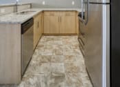 Thumbnail 10 of 31 - a kitchen with stainless steel appliances and marble counter tops