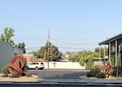 Thumbnail 6 of 7 - Gratitude sculptures and parking lot