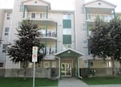 Thumbnail 1 of 3 - Apartment complex with a no parking sign in front.