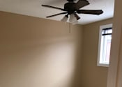 Thumbnail 4 of 9 - a ceiling fan in a room with a window