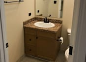 Thumbnail 6 of 9 - a bathroom with a sink and a mirror