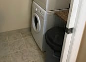 Thumbnail 7 of 9 - a washing machine and dryer in a bathroom