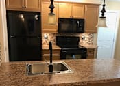 Thumbnail 5 of 9 - a view of the kitchen from the living room
