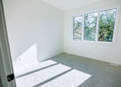 Thumbnail 6 of 44 - A room with a window and a door.
