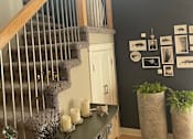 Thumbnail 6 of 15 - A staircase with a light shining on it.