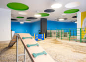 Thumbnail 5 of 12 - a large table with four skateboards on top of it in a room with blue walls and