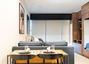 Thumbnail 12 of 12 - a living room with a couch and two tables