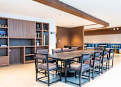 Thumbnail 4 of 12 - a long table with chairs and a bookshelf