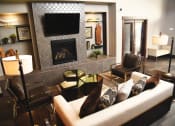 Thumbnail 9 of 53 - a living room with a couch and a fireplace