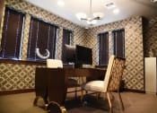 Thumbnail 19 of 53 - a home office with a desk and a computer