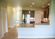 Thumbnail 43 of 53 - an empty kitchen with a white counter top