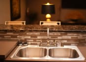 Thumbnail 50 of 53 - a kitchen sink with a granite counter top