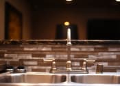 Thumbnail 52 of 53 - a stainless steel sink with a faucet in a bathroom