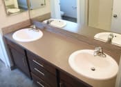 Thumbnail 47 of 53 - a bathroom with two sinks and a large mirror
