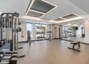 Thumbnail 39 of 59 - a large fitness room with treadmills and other exercise equipment