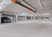Thumbnail 19 of 59 - an empty parking garage with a car parked in it