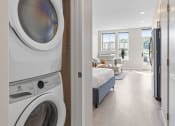 Thumbnail 51 of 59 - a washer and dryer in a bedroom
