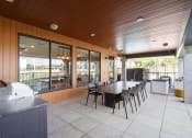 Thumbnail 30 of 59 - an outdoor patio with tables and chairs