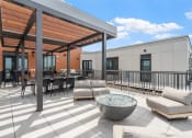 Thumbnail 44 of 59 - a patio with couches and tables and chairs