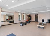 Thumbnail 40 of 59 - a spacious fitness room with a ping pong table and other exercise equipment