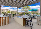 Thumbnail 6 of 63 - townhomes at horizon ridge spacious outdoor patio with bar and pool