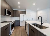Thumbnail 5 of 49 - a kitchen with a sink and a counter top
