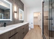 Thumbnail 4 of 49 - a bathroom with a sink and a shower